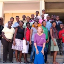 Rose on steps with students